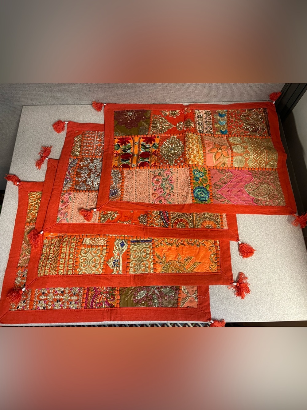 Set of 4 orange embroidered  placemats; new and unused